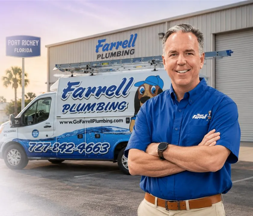 Farrell Plumbing owner in front of a Farrell Plumbing service van in Port Richey, Florida